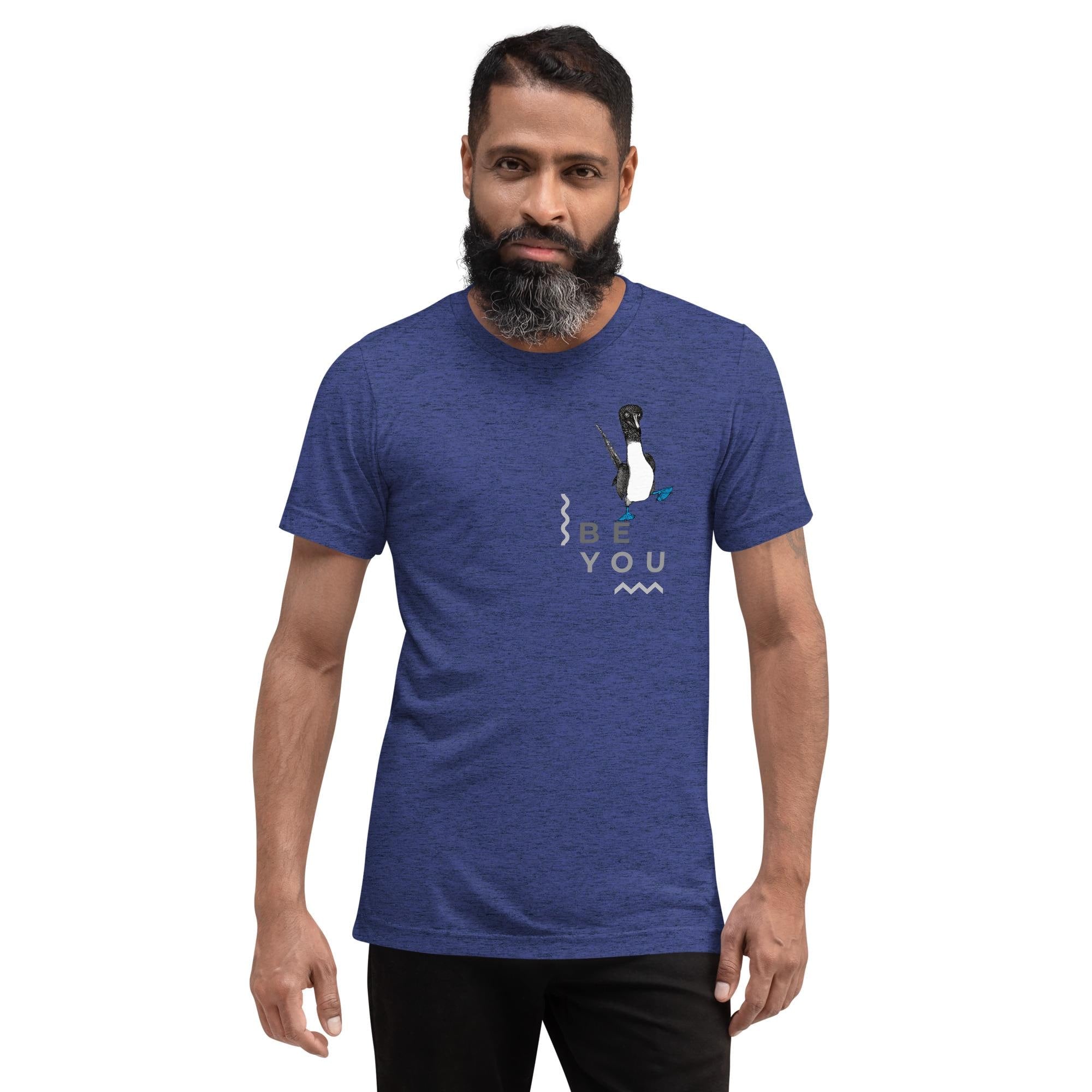 Navy triblend t-shirt featuring Be You in bold text with a detailed illustration of a blue-footed booby. Soft, lightweight fabric with a comfortable fit, showcasing lifelike textures in the artwork.